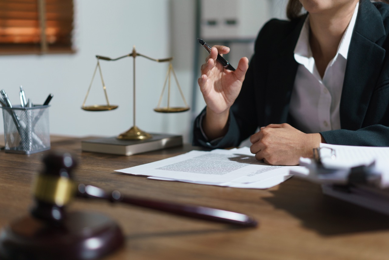 Businesswoman lawyer talks and explaining agreement business for construction permit of contract to client in legal office.